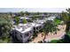 An aerial view of several condo units featuring well-manicured landscaping and community setting at 7700 E Gainey Ranch Rd # 127, Scottsdale, AZ 85258