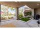 Covered patio with decorative turf and desert landscaping, ideal for outdoor relaxation and entertaining at 7700 E Gainey Ranch Rd # 127, Scottsdale, AZ 85258