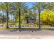 Welcome to Gainey Ranch with palm trees and inviting signage, creating a grand entrance at 7700 E Gainey Ranch Rd # 127, Scottsdale, AZ 85258