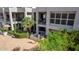 Stunning two-story condo featuring balconies and a well-maintained yard with an American flag at 7700 E Gainey Ranch Rd # 127, Scottsdale, AZ 85258