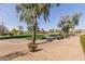 Scenic golf course view with trees and blue sky, great for outdoor recreation and relaxation at 7700 E Gainey Ranch Rd # 127, Scottsdale, AZ 85258