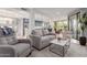 Open-concept living room featuring a modern kitchen, dining area, and comfortable seating at 7700 E Gainey Ranch Rd # 127, Scottsdale, AZ 85258
