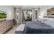 Beautifully appointed bedroom with a balcony offering golf course views, comfortable king bed, and natural light at 7700 E Gainey Ranch Rd # 127, Scottsdale, AZ 85258