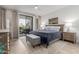 Serene primary bedroom with a plush bed, neutral decor, and access to a private balcony at 7700 E Gainey Ranch Rd # 127, Scottsdale, AZ 85258