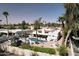 Aerial view of backyard with pool, patio, desert landscaping, and privacy fence at 8717 E Spanish Barb Trl, Scottsdale, AZ 85258