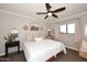 Comfortable bedroom features a ceiling fan and Southwestern-themed decorative touches at 8717 E Spanish Barb Trl, Scottsdale, AZ 85258