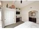 Well-lit bedroom includes a convenient kitchenette and a pass-through to an en suite bathroom at 8717 E Spanish Barb Trl, Scottsdale, AZ 85258