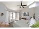 Inviting bedroom features vaulted ceilings, an abundance of natural light, and neutral colors at 8717 E Spanish Barb Trl, Scottsdale, AZ 85258