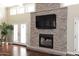 Close-up of a stone fireplace featuring a mantle and gas insert at 8717 E Spanish Barb Trl, Scottsdale, AZ 85258