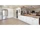 Spacious kitchen with granite countertops, stainless steel appliances, and an island cooktop at 8717 E Spanish Barb Trl, Scottsdale, AZ 85258