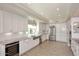 Modern kitchen with stainless steel appliances, white cabinets, and granite countertops at 8717 E Spanish Barb Trl, Scottsdale, AZ 85258