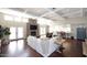 Open-concept living room with stone fireplace, large windows, and seamless flow to the kitchen at 8717 E Spanish Barb Trl, Scottsdale, AZ 85258