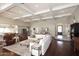 Bright living room features coffered ceilings, hardwood floors, and flows into the dining area at 8717 E Spanish Barb Trl, Scottsdale, AZ 85258