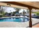 Inviting backyard with a sparkling swimming pool and comfortable seating areas at 8717 E Spanish Barb Trl, Scottsdale, AZ 85258