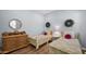 Comfortable bedroom featuring two twin beds, wooden floors, and neutral decor at 8965 E Mountain Spring Rd, Scottsdale, AZ 85255