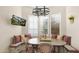 Cozy breakfast nook with a built-in bench, wooden table, and decorative lighting fixture at 8965 E Mountain Spring Rd, Scottsdale, AZ 85255