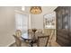 Cozy dining room with a round wooden table, comfortable chairs, and built in cabinet at 8965 E Mountain Spring Rd, Scottsdale, AZ 85255