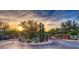 Community entrance showcasing a beautifully landscaped entry gate with sunset view at 8965 E Mountain Spring Rd, Scottsdale, AZ 85255