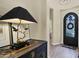 Elegant entryway with decorative door, ornate table, and neutral decor at 8965 E Mountain Spring Rd, Scottsdale, AZ 85255