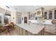 Spacious gourmet kitchen featuring a large center island with granite countertops and custom cabinetry at 8965 E Mountain Spring Rd, Scottsdale, AZ 85255