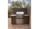 Outdoor kitchen featuring a stainless steel grill with granite countertop and brick patio at 8965 E Mountain Spring Rd, Scottsdale, AZ 85255