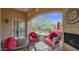 Comfortable patio with a fireplace, ceiling fan, and beautiful view at 8965 E Mountain Spring Rd, Scottsdale, AZ 85255