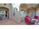 Comfortable outdoor patio with neutral stucco architecture and brick pavers at 8965 E Mountain Spring Rd, Scottsdale, AZ 85255