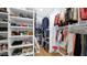 Organized walk-in closet with ample shelving and hanging space for clothes and accessories at 8965 E Mountain Spring Rd, Scottsdale, AZ 85255