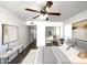 Modern bedroom with a ceiling fan, sliding mirrored closet doors and neutral decor at 985 N Granite Reef Rd # 134, Scottsdale, AZ 85257