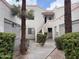 Inviting two-story condo exterior with landscaped courtyard, enhancing curb appeal at 985 N Granite Reef Rd # 134, Scottsdale, AZ 85257