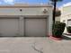 Attached two car garage with modern doors and exterior security features at 985 N Granite Reef Rd # 134, Scottsdale, AZ 85257