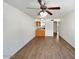 Open floor plan with ceiling fan connecting the living room and kitchen area at 985 N Granite Reef Rd # 134, Scottsdale, AZ 85257