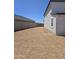 Backyard area with view of adjacent property and mountain views at 10031 S 23Rd Dr, Phoenix, AZ 85041