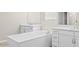 Bright bathroom featuring double vanities, soaking tub, and modern fixtures at 10031 S 23Rd Dr, Phoenix, AZ 85041