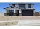 Beautiful two-story home with a modern design, a two car garage and stone accents at 10031 S 23Rd Dr, Phoenix, AZ 85041