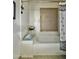 Bathroom featuring a bathtub and decorative tile at 10224 E Minnesota Ave, Sun Lakes, AZ 85248