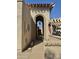 Inviting courtyard entrance with arched entryway offering a warm welcome to the property at 10224 E Minnesota Ave, Sun Lakes, AZ 85248