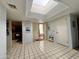 Open foyer featuring tile floors and a skylight, offering natural light and an inviting space at 10224 E Minnesota Ave, Sun Lakes, AZ 85248