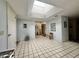 Bright foyer with tile flooring and a skylight, creating a welcoming entrance to the home at 10224 E Minnesota Ave, Sun Lakes, AZ 85248