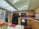 Kitchen with black appliances at 10224 E Minnesota Ave, Sun Lakes, AZ 85248