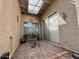 Enclosed patio area features a gravel floor, providing a private outdoor space for relaxation at 10224 E Minnesota Ave, Sun Lakes, AZ 85248