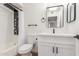 Modern bathroom featuring a sleek vanity, elegant fixtures, and a shower with a stylish black shower system at 10750 W Abbott Ave, Sun City, AZ 85351
