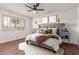 Well-lit main bedroom with a ceiling fan and shutters on the window at 10750 W Abbott Ave, Sun City, AZ 85351