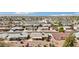 Overhead perspective of a suburban area with tidy homes, organized streets, and solar panels visible on some roofs at 11001 N Madison Dr, Sun City, AZ 85351