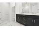 Contemporary bathroom features double vanity, open shelving, and walk-in shower at 1123 E Mcneil St, Phoenix, AZ 85042