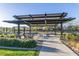 Outdoor community gathering space with seating areas and shade structure at 1123 E Mcneil St, Phoenix, AZ 85042