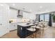 Modern kitchen with stainless steel appliances, a large island, and bright white cabinets at 1123 E Mcneil St, Phoenix, AZ 85042