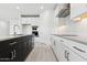 Modern kitchen featuring a center island, stainless steel appliances, and a subway tile backsplash at 1123 E Mcneil St, Phoenix, AZ 85042