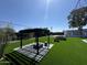 Beautiful backyard oasis with a stylish pergola, and lush lawn perfect for outdoor entertaining at 12209 N 66Th St, Scottsdale, AZ 85254