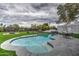 Resort-style backyard featuring a sparkling pool, lounge area, and lush landscaping at 12209 N 66Th St, Scottsdale, AZ 85254